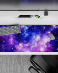 Calm night-sky desk pad 36x16 inches in violet, indigo, and icy blue with bright star pops.
