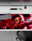 36x16 inches anime desk pad featuring Tanjiro Kamado’s fierce expression from Demon Slayer, perfect for elevating your workspace.