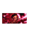 Tanjiro Kamado from Demon Slayer: Kimetsu no Yaiba featured on a 28x12 inches mouse pad, adding intense anime action to your setup.