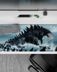 Teal-and-charcoal 36x16 inches anime desk pad, gritty and ominous, with foamy sea spray and dark skies.