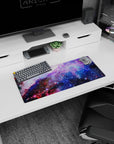 Star-speckled nebula cloud scene mouse pad 28x12 inches, glitter-like dots across a galaxy sky.