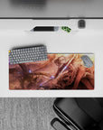 28x12 inches fantasy anime mouse pad in copper, rose, and gold sunset tones with blue magic sparks.