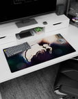 32x16 inches anime mouse pad showing a brooding boy in a loose white shirt, knees up, hand near lips.