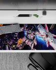 36x16 inches anime desk pad in steel gray, neon pink lines, deep-space blues, sparks, late-night grind vibe.