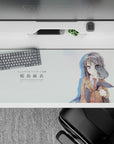36x16 inches anime desk pad in mint white tones with inky hair, violet eyes, calm cute flirty vibe.