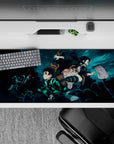 36x16 inches anime desk pad featuring Tanjiro and Nezuko in a fierce battle scene from Samurai Spirits, ideal for anime fans.