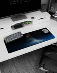 Ring-like tower rising above starry clouds on a midnight sky mouse pad, 32x12 inches.