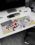 Two graceful anime shrine maidens sweeping across the desk pad 36x16 inches with drifting petals.
