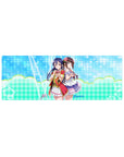 32x12 inches anime girl mouse pad with Umi Sonoda and Dia Kurosawa, pastel zigzag background.