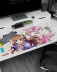 40x20 inches anime desk pad featuring curly brown girl with tiny horns and pink-haired girl with headphones.