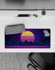 28x12 inches mouse pad with synthwave design, featuring glowing yellow sunset, neon blue mountains, and purple grid for a bold, nostalgic aesthetic.