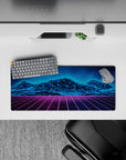 Compact 28x12 desk mat highlights glowing blue mountains and purple grid for immersive retro-futuristic vibes