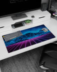 Futuristic 80s design on 32x16 desk mat brings Synthwave Mountains' vibrant aesthetic to life vividly