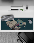 Inosuke from Demon Slayer mid-punch on a 32x12 inch mouse pad, dynamic pose with teal backdrop highlighting his intensity.