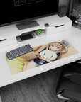 Lavender-eyed anime girl in a hoodie cuddling a sleepy white cat plush mouse pad, 32x12 inches.