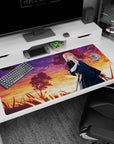 Anime desk pad 40x20 inches showing a pink-haired swordswoman guarding a field under vivid dusk clouds.