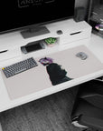 Demon-horned anime girl in black mask and inky jacket with drifting dust flecks desk pad 36x16 inches.