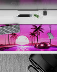 36x16 inches desk pad with synthwave design, blending a retro car, neon road, palm trees, and a glowing sun for a futuristic, retro vibe.