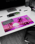 Modern 32x16 inches mouse pad featuring synthwave design, with a glowing retrowave sun, retro car, neon road, and palm trees for nostalgic flair.