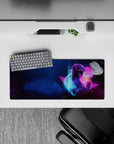 Compact 28x12 desk mat highlights deep space blues and neon accents for immersive cosmic vibes