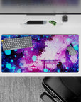 Dynamic 32x16 deskmat combines soft purples, pinks, and glowing blues for visually striking yet calming visuals