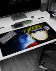 Naruto Uzumaki staring forward with sharp whisker marks and blue eyes on desk pad 40x20 inches.