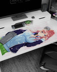 Red-haired anime girl with headphones and blue hoodie under drifting petals desk pad 40x20 inches.