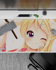 Cozy peach-and-pink anime desk pad 40x20 inches with blossoms and a comforting sparkle-eyed vibe.