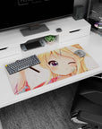 Blonde anime girl winking in a yukata on mouse pad 32x16 inches, floral backdrop and playful pin.
