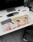Winking blonde anime girl in yukata on desk pad 36x16 inches, floral background and cute hairpin.