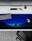 Calming 36x16 inches anime desk pad in deep greens and soft blues, sapphire stars, peaceful nightscape mood.