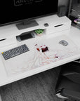 Anime fox girl with snowy hair and sharp pink eyes behind a dark feathered fan on 36x16 inches desk pad.