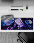 32x12 inches anime girl mouse pad in deep indigo and icy blue, speckled like snow with crimson accents.