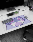 Chibi anime girl with puffy cheeks and wide spiral eyes staring at you on mouse pad, 32x16 inches.