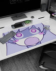 Shocked chibi anime girl with big spiral eyes and “O” mouth guarding your desk, 40x20 inches.