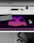 36x16 inches desk pad with synthwave retrowave design, blending neon sunset, gridlines, and bold pink and purple colors for a retro-futuristic look.