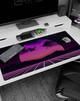 Large 40x20 inches desk pad featuring synthwave retrowave design, with a glowing neon sunset, gridlines, and bold pink and purple retro hues.