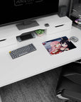 Pink-haired girl clings to fox-eared black-haired anime girl by snowy water on a 14x10 inches mouse pad.