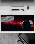 Moody cosmic mouse pad 32x16 inches in smoky purples, midnight blues, and a fiery orange nebula streak.
