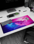 Starry nebula scene desk pad 36x16 inches, swirling space clouds with scattered starlight speckles.