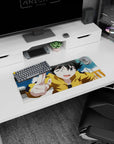 Cheeky winking anime girl in yellow hoodie against blue sky on a 28x12 inches extended mouse pad.