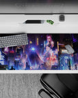 36x16 inches mouse pad with cyberpunk metropolis design, featuring neon purples, blues, and pinks for a dynamic, futuristic workspace atmosphere.