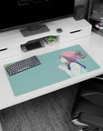 32x16 inches anime girl mouse pad showing a smiling girl in a blush beanie holding a warm cup in profile.