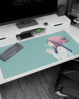 Anime girl in blush beanie holding a warm cup on a 40x20 inches desk pad, serene side view in teal.