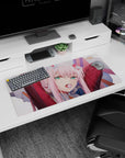 Modern 32x16 inches mouse pad featuring Zero Two from Darling in the Franxx, blending her strong attitude with the softness of pink tones.