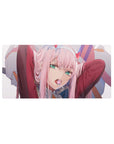 Mouse pad featuring Zero Two from Darling in the Franxx, 32x16 inches, with her lollipop and a daring look in her eyes, exuding boldness.