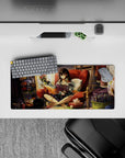 28x12 inches anime girl mouse pad in warm oranges and deep reds, cozy lamp-lit creative clutter vibe.
