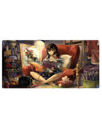 32x16 inches anime girl mouse pad with cozy brunette in red chair, book, paintbrush, and studio clutter.