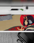 36x16 inches desk pad in soft beige with bold red sun and teal patterns, calm mischievous vibe.