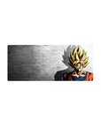 Mouse pad featuring Goku’s Super Saiyan silhouette, 28x12 inches, with light and shadow contrasts, perfect for adding minimalist energy to your desk.